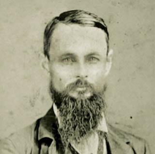 1874年，TCU创始人伦道夫·克拉克(Randolph Clark)的黑白肖像，他是一位留着胡子的中年男子.